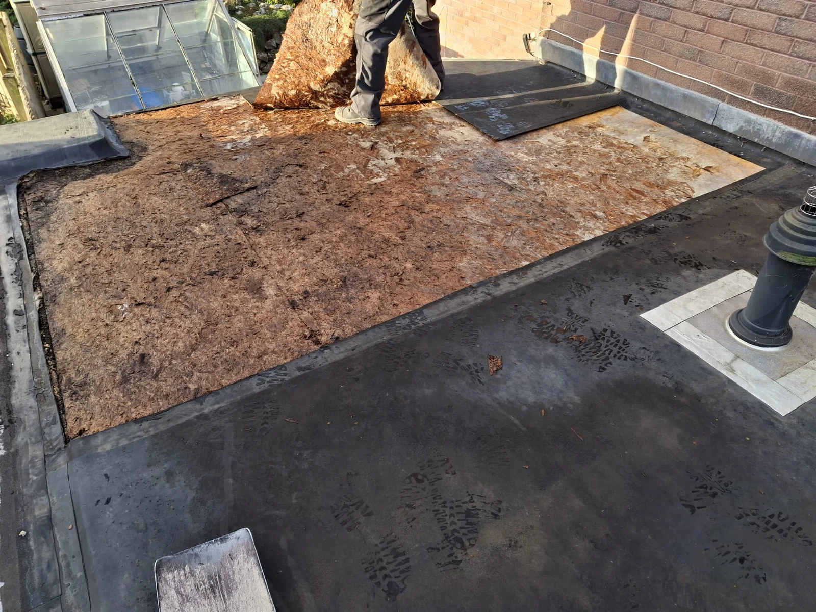Roof decking exposed during flat-roof work