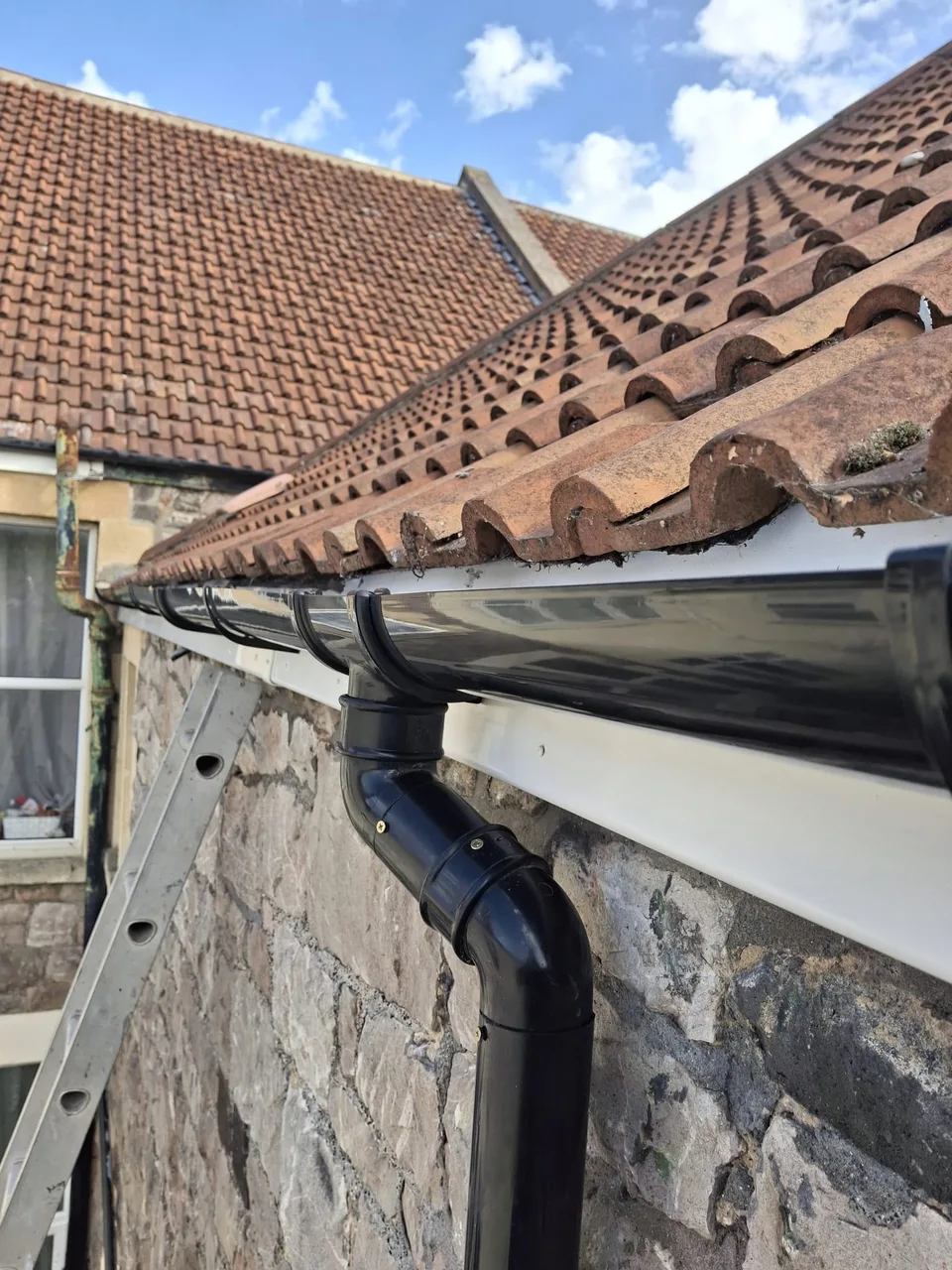 Completed gutter outlet and downpipe connection
